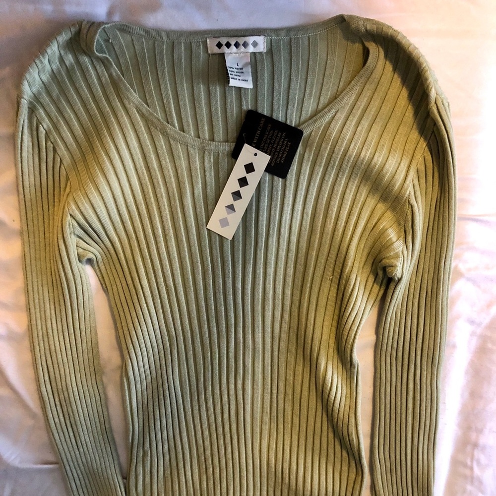 NEW with tags. Unknown brand Sweater.